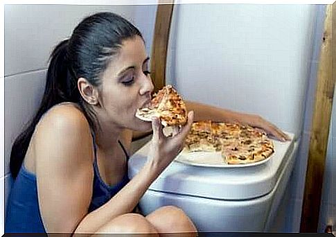 Woman eating pizza