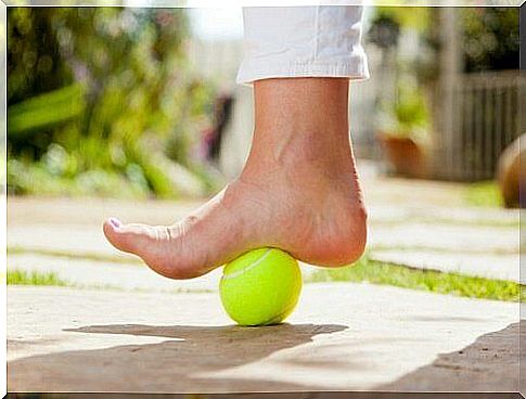 Tennis ball under one foot