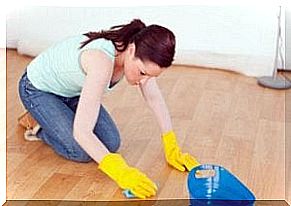 Woman cleans floor