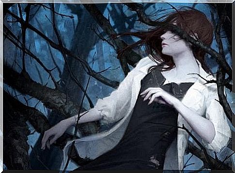 Woman in a dark forest surrounded by twigs