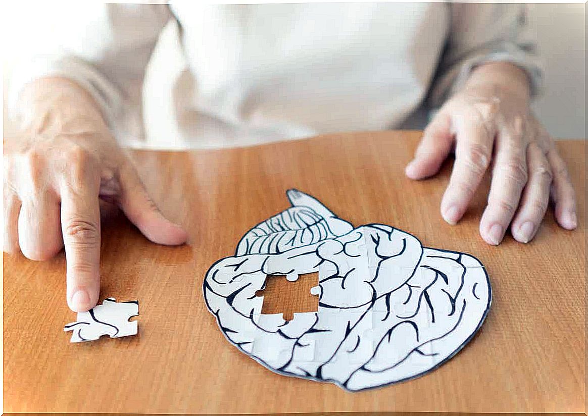 A woman putting together a brain puzzle.