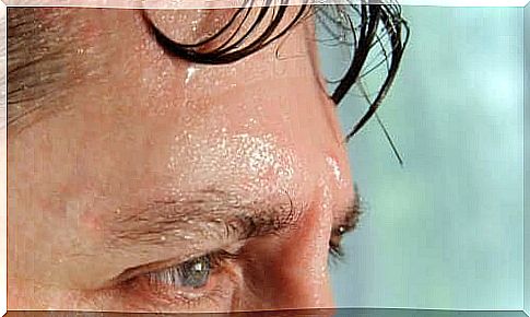 A man sweating from his forehead