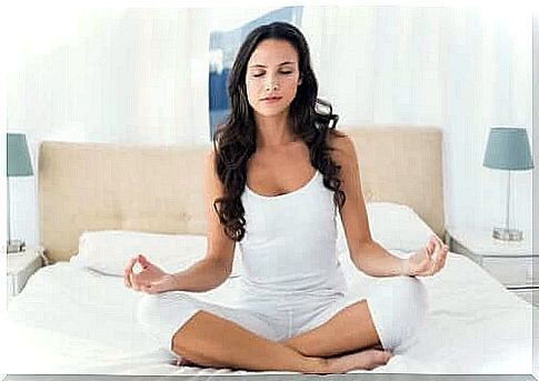 woman meditating - yoga exercises to deal with stress