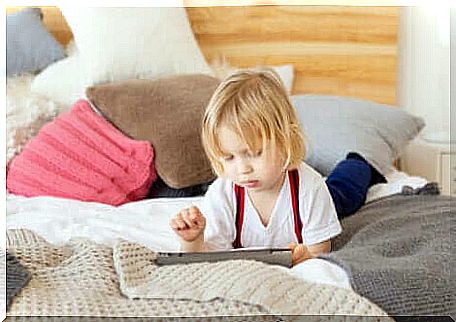 A child playing on a tablet.