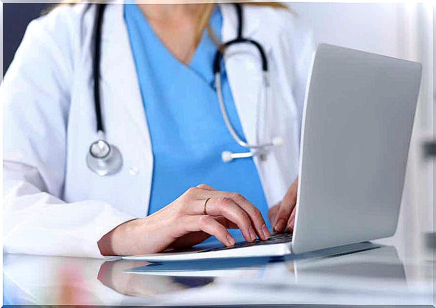 A doctor on a computer