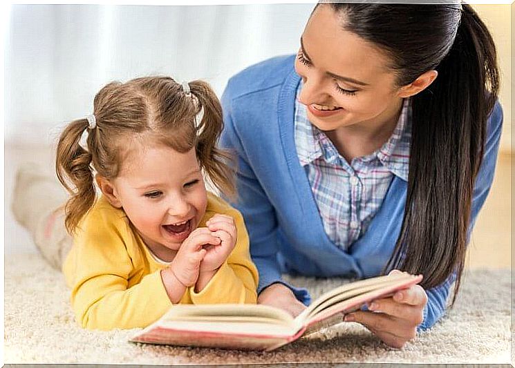 Mother and daughter reading a book