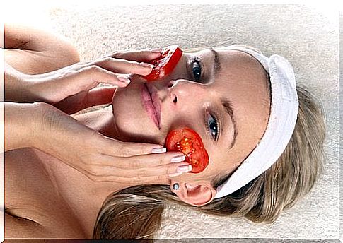 Woman with tomatoes on her face