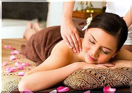 A woman receiving a therapeutic massage