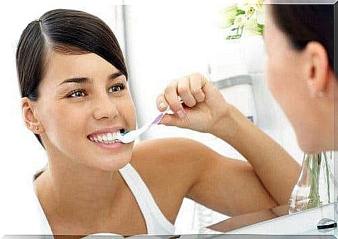 Girl brushing her teeth.