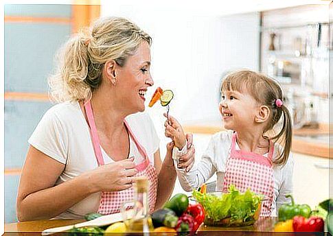 Mother and daughter eating.