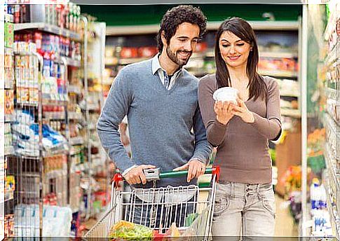 Couple looking at the food label in the store