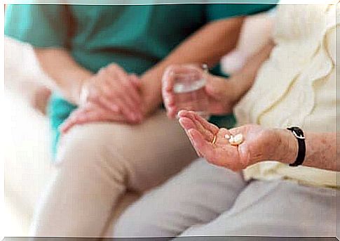 A woman taking pills.