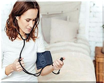 woman taking blood pressure